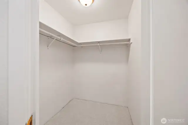 Larger bedroom walk-in closet.