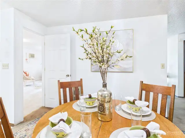The open kitchen dining room floor plan makes entertaining guests engaging for all.