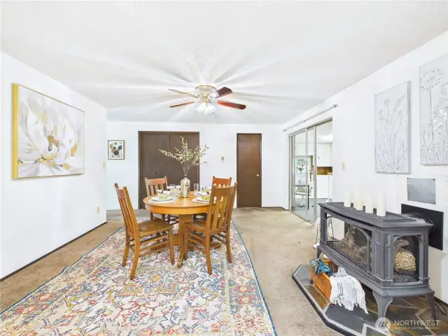 A freestanding fireplace adds coziness to the space.