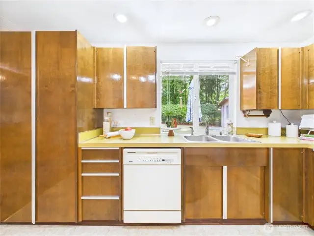 White appliances and wood cabinets.