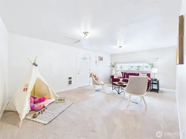 The extra living room is a converted garage that gives you a space to use as you like. TV room? Play room? Hobby room? What else...?