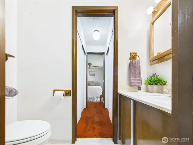 Cute half bath with access from the third bedroom and the dining room makes this floorplan very versatile.