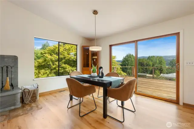 Dining area with sliding glass doors leading to the entertainment size deck