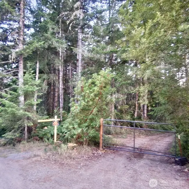 Gated drive leads to interior of parcel