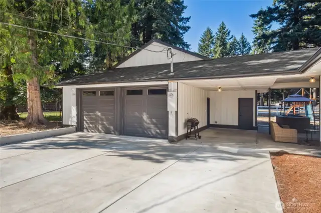 Detached 2-car garage plus 900 sq ft carport with RV power!