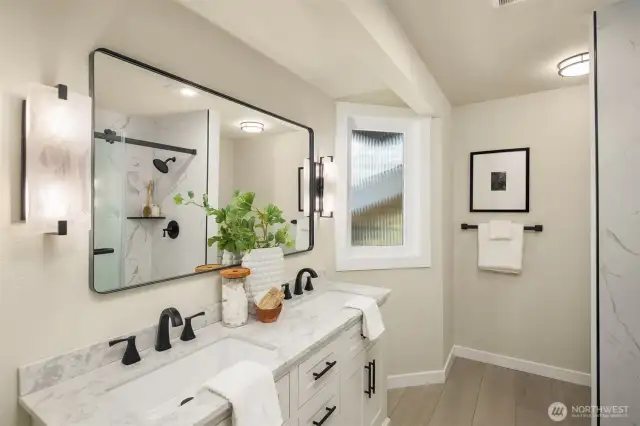 Primary bath has double vanity and sinks.