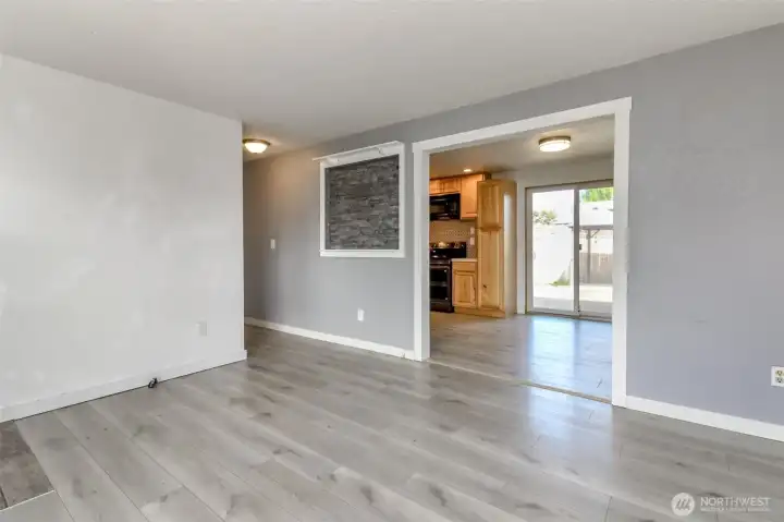 Living roomheading into the kitchen and down the hall,
