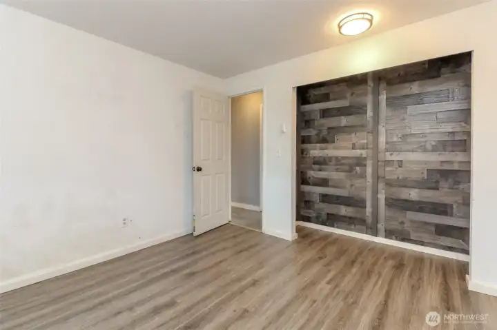 Closet with Wood accents.
