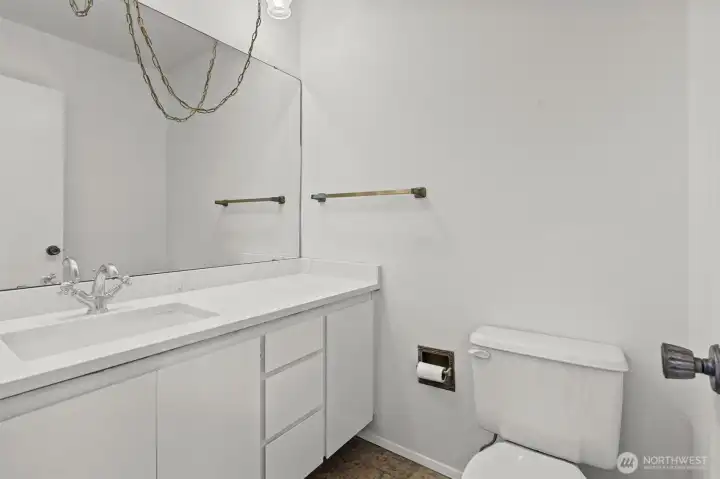 New countertops, sink  and paint in the main floor powder room.