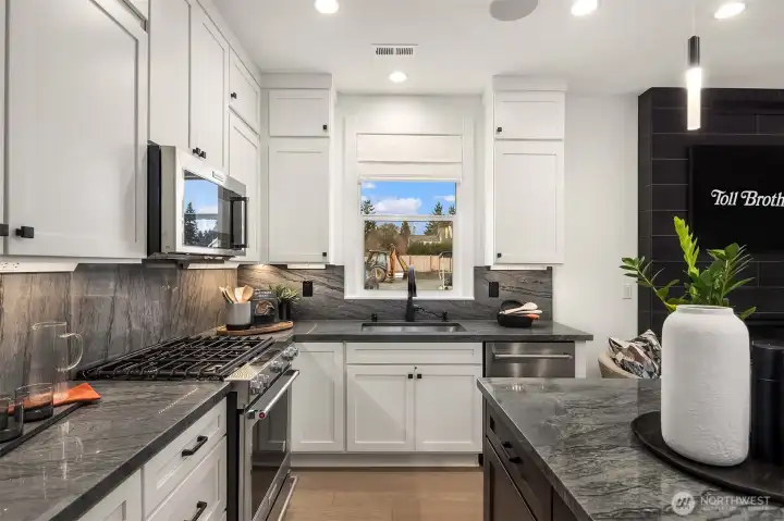 Photos are of a previous model of similar floorplan. Details, surfaces and features may differ. For demonstration purposes only.
