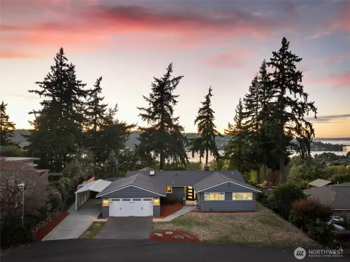 Sunset aerial view front of home
