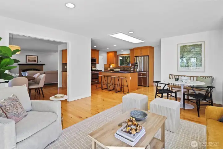 Secondary flex living space opens to dining area and eat-in kitchen with timeless design, stainless steel appliances, large island