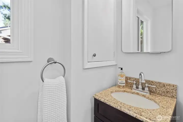 Additional 1/2 bath off laundry area
