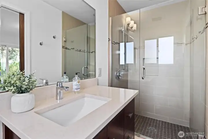Updated Primary bath with tiled shower base & surround.