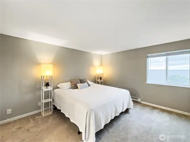 Primary bedroom with view to the bay.