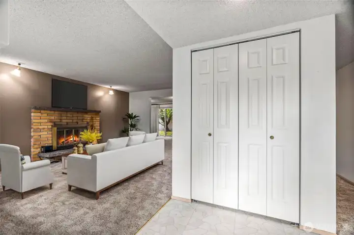 Front entry with the living room located to the left. (staged)