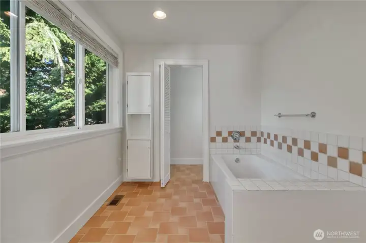 Oversized  primary tub, private with lots of natural light.