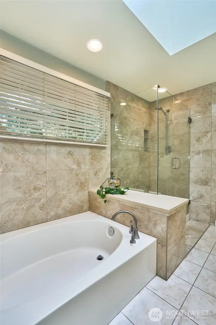 Primary bathroom also has separate bath tub and shower.