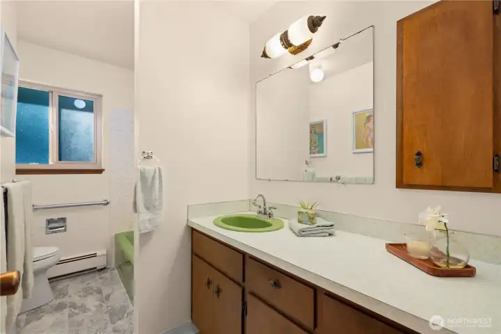 Second upstairs bathroom preserves the mid-century touches.