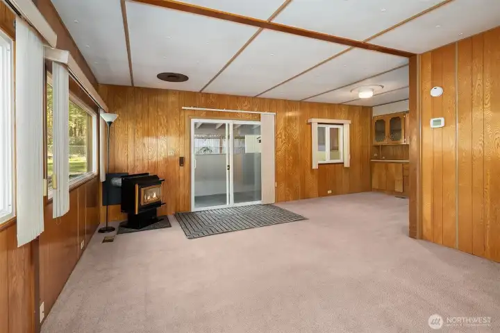 Living room with Fireplace, Classic Paneling and Carpet