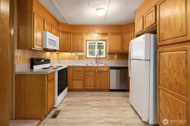 Kitchen with new sink and microwave with updated stove, Dishwasher, and Fridge