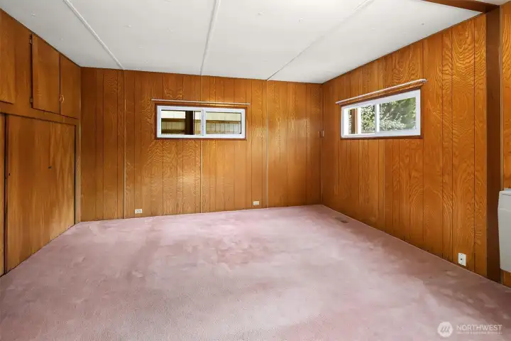 Primary with window into giant bay of Carport