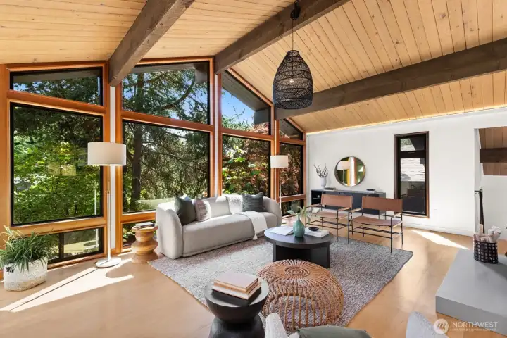 If this isn't Pacific Northwest, I don't know what is! This room is a showstopper, lined with south-facing floor-to-ceiling windows, set up from the street.