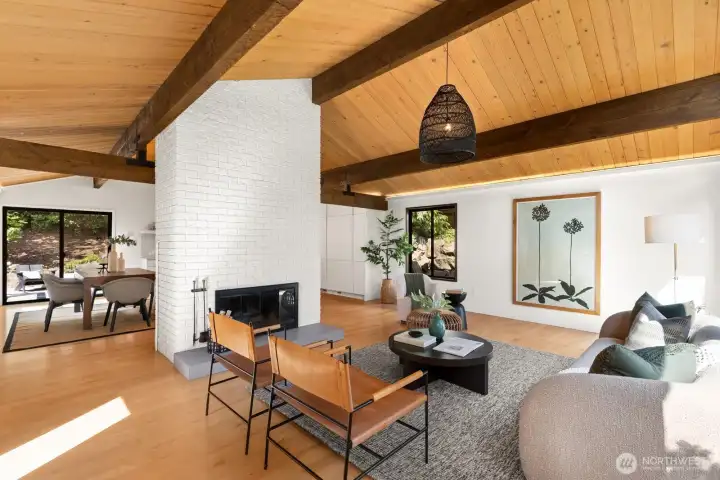 Dining room pictured to the left in this photo. The area to the right of the fireplace can accommodate another dining table, desk, art table, you name it.