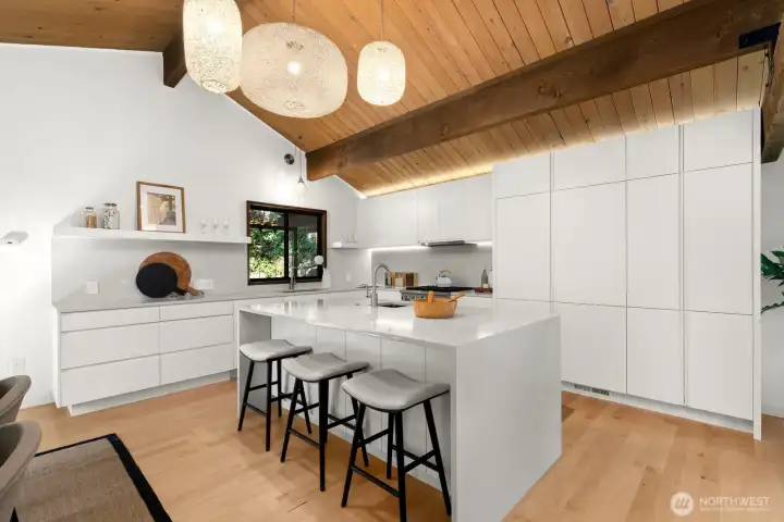 Every space in this house was designed with intention! The fridge is pictured beyond the island.