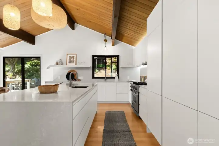 Everyone needs a window just beyond their kitchen sink. That window overlooks the covered deck out back.