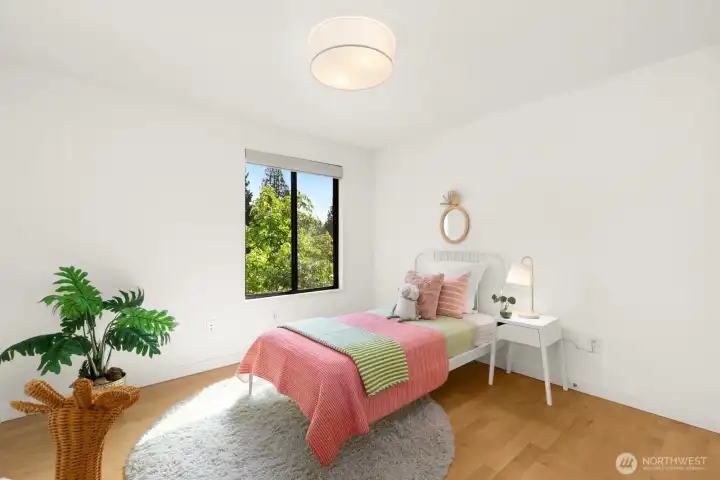 One of two other bedrooms on the main level. This room is light and cheery - and can accommodate more than one bed (or a larger one).
