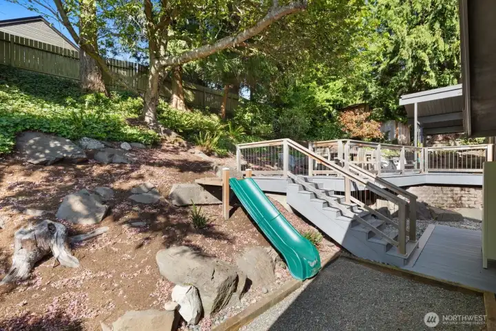 Next to the stairs is a slide for the youthful ones. You land in the gravel pit!
