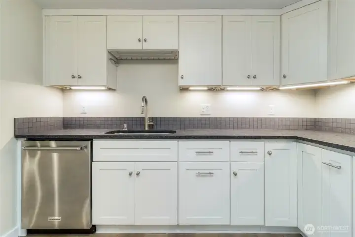 Stainless steel appliance package and updated cabinets.
