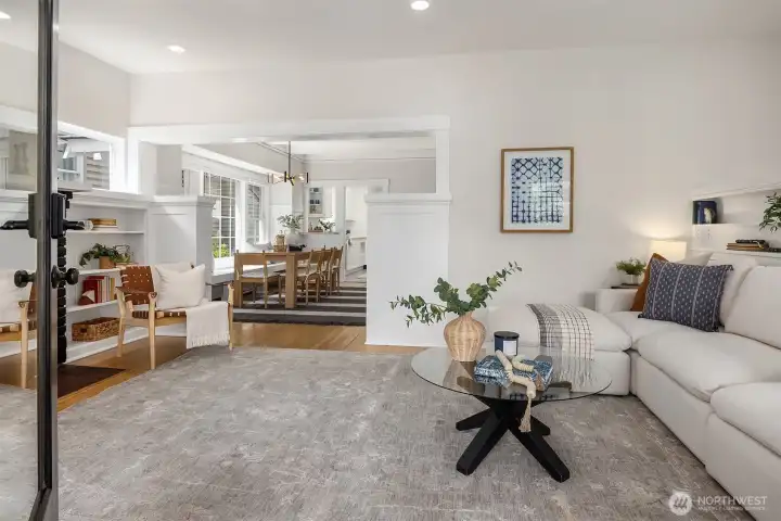 Light filled living room with wood fireplace