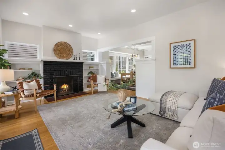 Light filled living room with wood fireplace