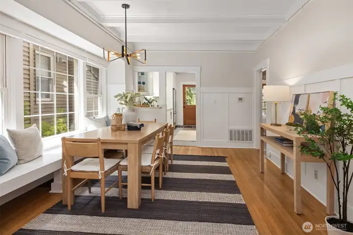 Generous dining room with tall ceilings and built in seating