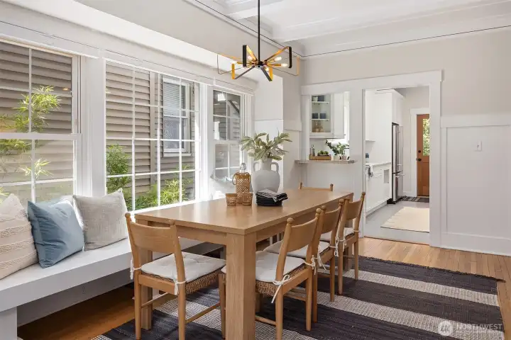 Generous dining room with tall ceilings and built in seating