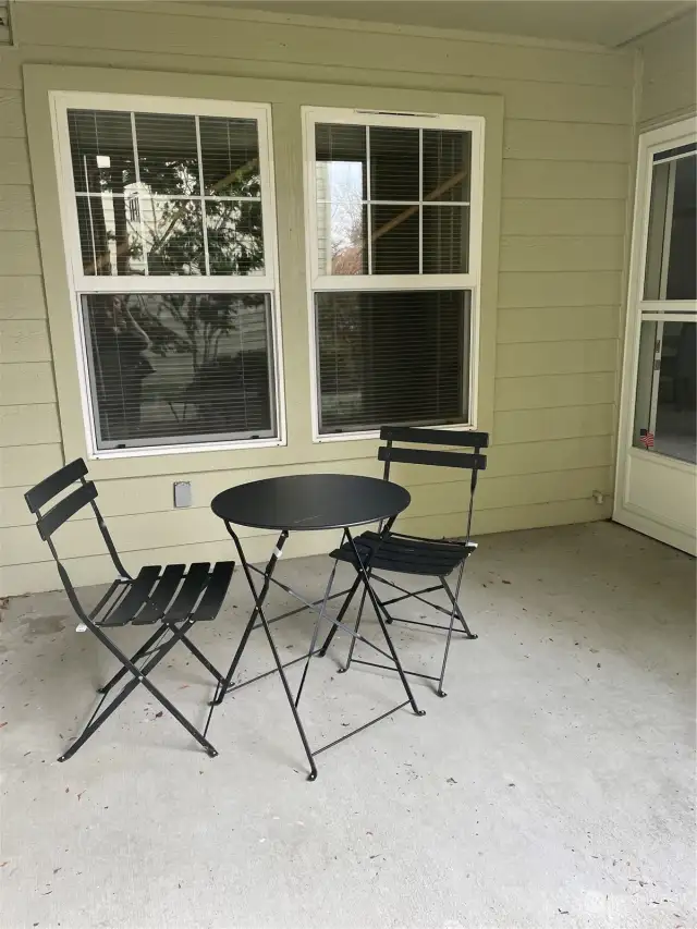 Patio off living room and view from bedroom. Private corner unit.