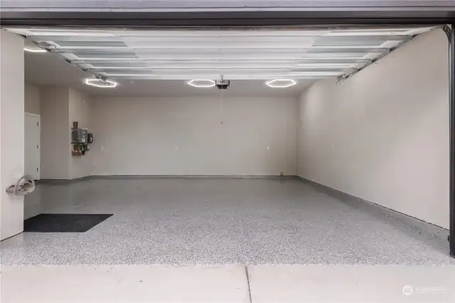 720 SF garage with 50-amp EV charger, epoxy floor, and extra space for a shop or hobbies