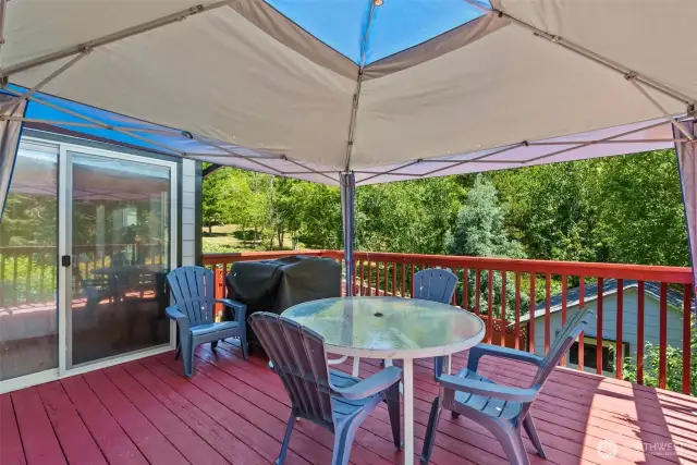 Large Deck flows from the Kitchen Dining and overlooks the garden