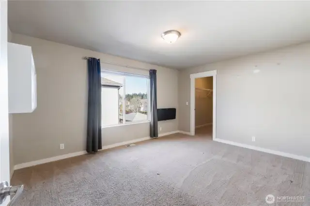 Bedroom 1 with a walk in closet