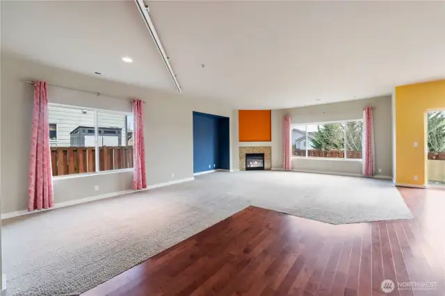 Bright and open living area with high ceilings and big windows