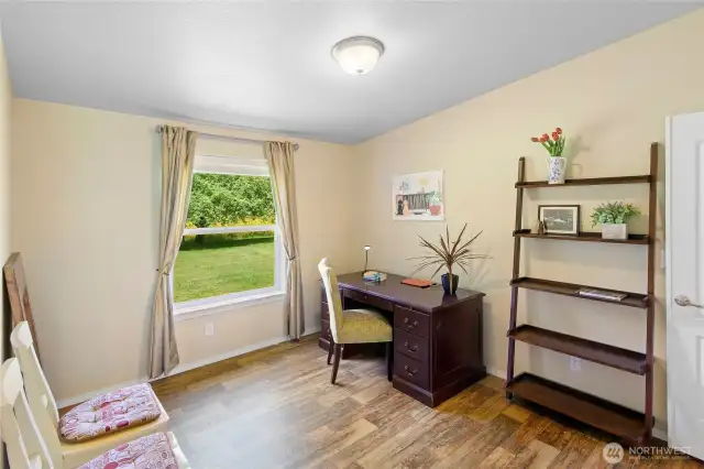 Bonus room off the living room and primary bedroom.