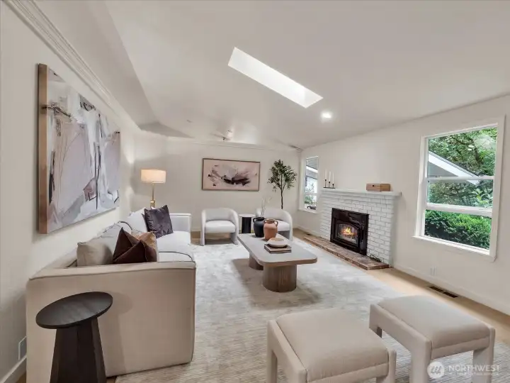 Spacious living area with open entry and natural light