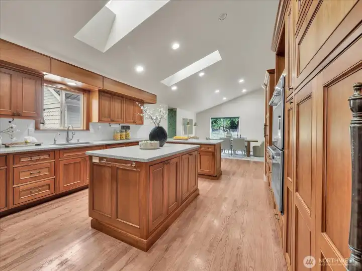 Gourmet kitchen with custom cabinetry and dual prep islands