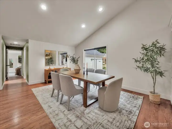 Formal dining space with modern décor and large picture window and serene outdoor views