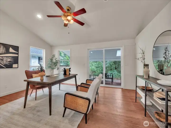 Bright home office with vaulted ceiling and serene outdoor views