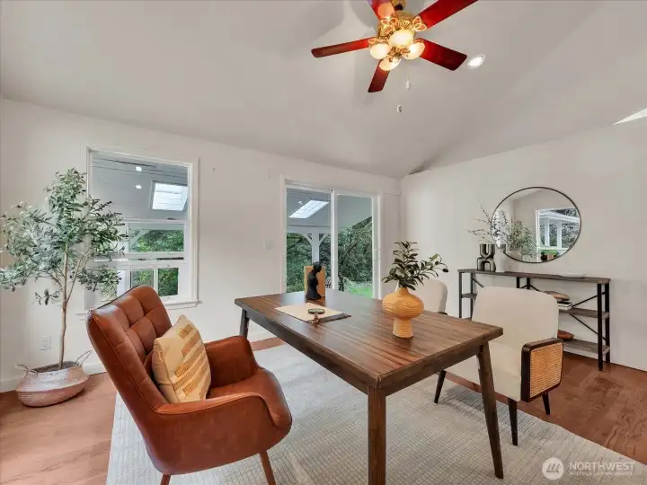 Bright home office with vaulted ceiling and serene outdoor views