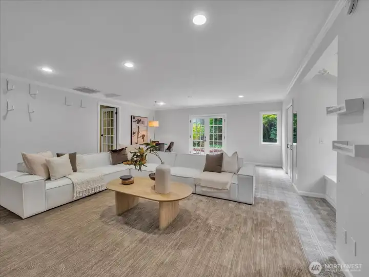 Expansive family room with natural light and backyard access