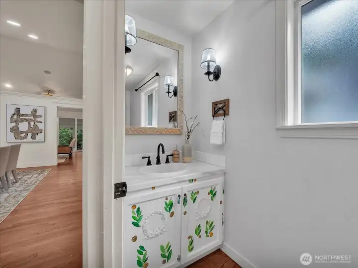 Powder bathroom with custom vanity and decorative finishes